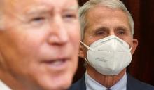 At the White House in Washington Nov. 29, Dr. Anthony Fauci, director of the National Institute of Allergy and Infectious Diseases, listens to President Joe Biden deliver an update on the omicron coronavirus variant. (CNS/Reuters/Kevin Lamarque)